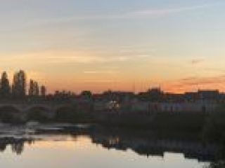 This was our view of the fireworks later that night -- all were set off from the little stand of trees that's on the tip of the island in the middle of the Loire River
