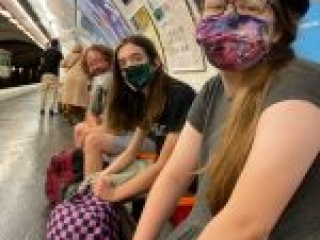 Smiling while waiting for the train